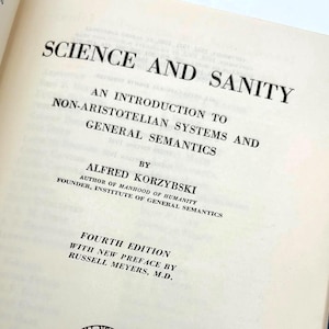 May include: Open book titled "Science and Sanity" by Alfred Korzybski. The book's cover is off-white with black text. The title is in a bold, serif font. The book is a fourth edition, published by The International Non-Aristotelian Library Publishing Company.