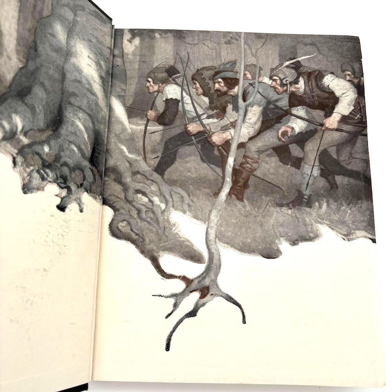 May include: An open book with a vintage illustration of a group of men running through a forest, each holding a bow and arrow. The artwork is in shades of gray, brown, and white, with a detailed depiction of trees and foliage.