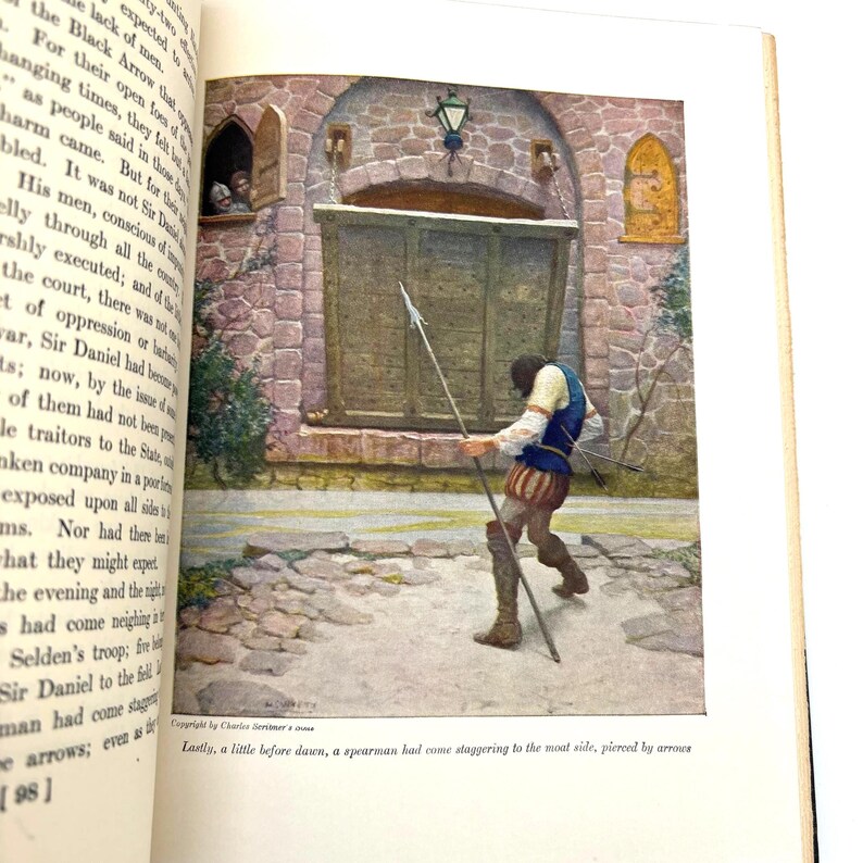 May include: An illustration from a book depicts a spearman in medieval attire, holding a spear and arrows, staggering near a stone gate. The scene is set in a castle courtyard, with a window showing figures. The text at the bottom reads: "Lastly, a little before dawn, a spearman had come staggering to the moat side, pierced by arrows."
