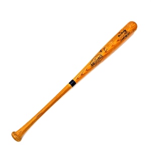 May include: A wooden baseball bat with a natural finish. The bat has a black band near the handle and the text "Adirondack" is visible. The bat is approximately 34 inches long.