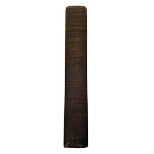 May include: A tall, dark brown book spine with visible text. The book appears to be old, with a textured cover. The title and author's name are printed vertically. The book is set against a white background.