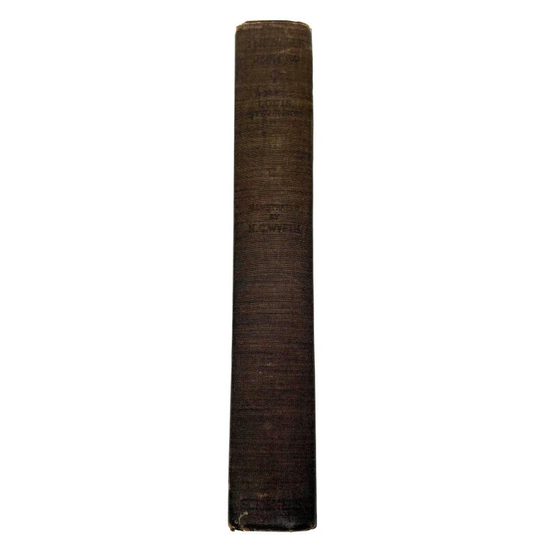 May include: A tall, dark brown book spine with visible text. The book appears to be old, with a textured cover. The title and author's name are printed vertically. The book is set against a white background.