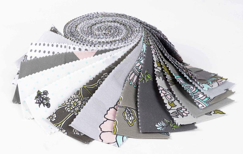 May include: A roll of fabric scraps in various shades of gray and white with floral and polka dot patterns. The fabric is pre-cut into 2.5 inch squares.