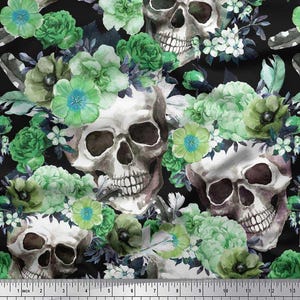 May include: A fabric pattern featuring watercolor skulls adorned with green and blue floral arrangements against a black background. The design includes various flower types and feather accents. The ruler at the bottom measures in inches.