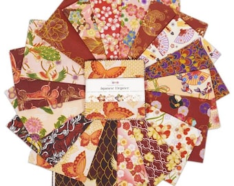 May include: A collection of 18 fabric squares featuring Japanese-inspired designs. The squares are in shades of red, gold, and cream with patterns of butterflies, flowers, and fans. The squares are arranged in a fan shape and labeled "Japanese Elegance".