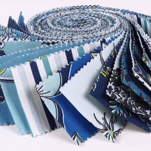 May include: A roll of blue and white fabric with various floral and striped patterns. The fabric is pre-cut into squares and is ready for quilting or other craft projects.