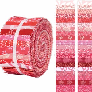 May include: A rolled bundle of red and pink fabric strips, secured with a white band. The fabric features various floral and patterned designs. Two columns of fabric strips are displayed to the right, showcasing the different patterns and shades of red and pink.