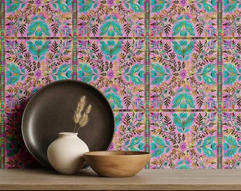 May include: A decorative arrangement featuring a dark brown plate, a small white vase with dried grass, and a wooden bowl on a wooden surface. The background is a patterned wallpaper with pink, teal, and brown floral designs.