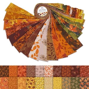 May include: A roll of 2.5 inch wide fabric strips featuring a variety of autumn-themed prints. The prints include leaves, sunflowers, and pine cones in shades of brown, orange, yellow, and green. The fabric is labelled "Autumn Serenity".
