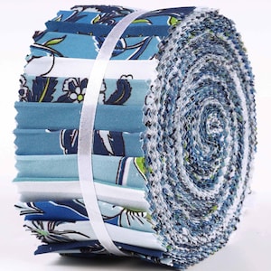 May include: A roll of blue and white fabric with a floral pattern. The fabric is pre-cut into 2.5 inch squares and is perfect for quilting or other craft projects.
