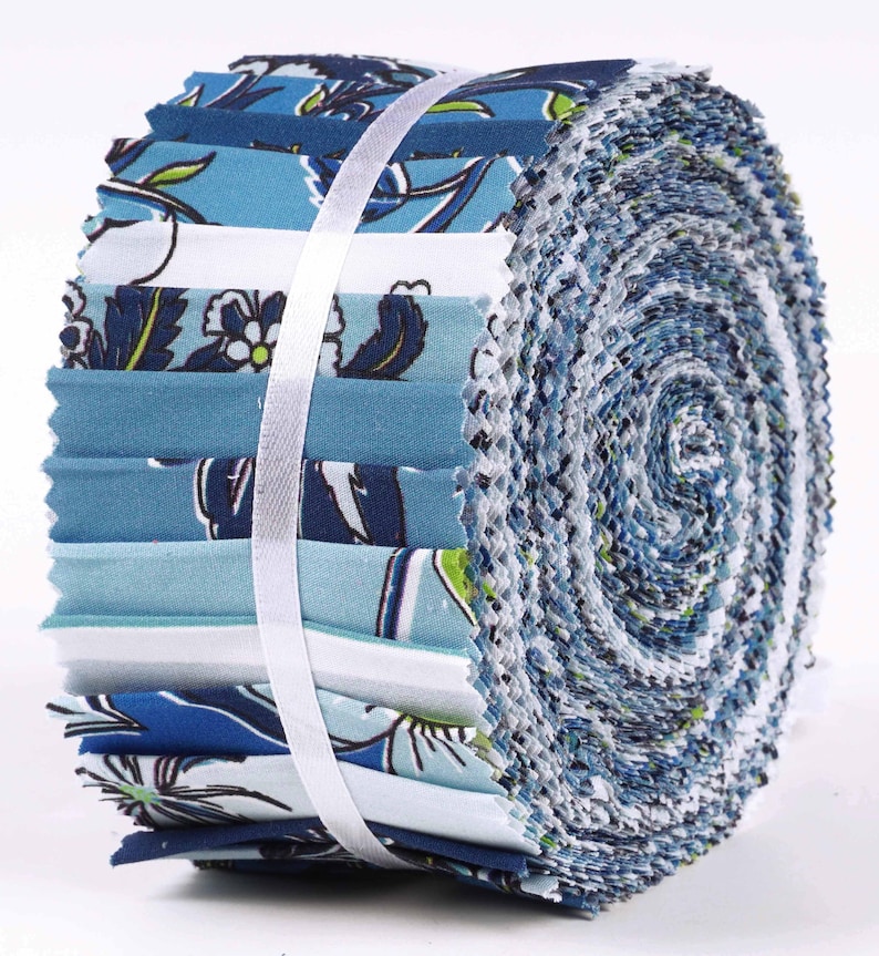 May include: A roll of blue and white fabric with a floral pattern. The fabric is pre-cut into 2.5 inch squares and is perfect for quilting or other craft projects.