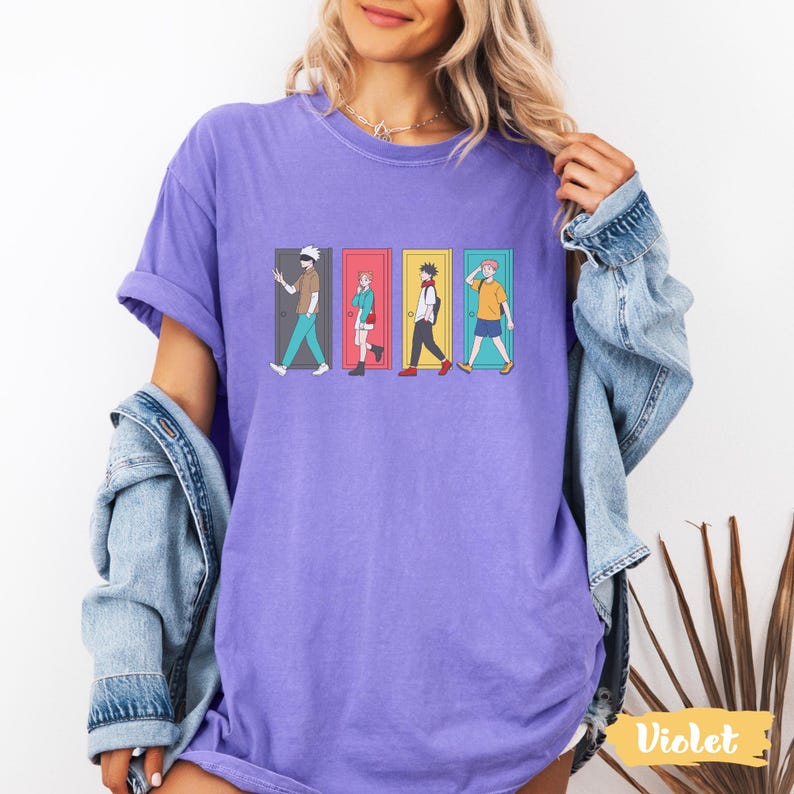 May include: A violet-colored t-shirt featuring a graphic of four anime characters walking through doors. Each character is depicted in a different outfit and pose, with varying hair colors and accessories. The shirt has a relaxed fit.
