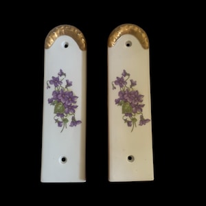 Pair of vintage limoge finger door plates with gold trim and purple flowers