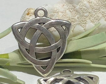 May include: Two silver Celtic knot charms in the shape of a triangle. The charms have a detailed design and are perfect for jewelry making.
