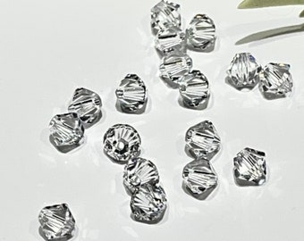 50 cuentas de cristal Swarovski transparentes: Xilion bicónico de 4 mm - Piedra natal de abril
