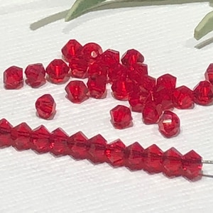 18 Light Siam Red Swarovski Crystal Bicone Beads (3mm)