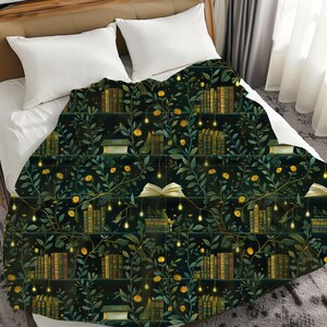 May include: A dark green throw blanket featuring a repeating pattern of bookshelves, books, yellow flowers, and fairy lights. The blanket is on a bed with white pillows.