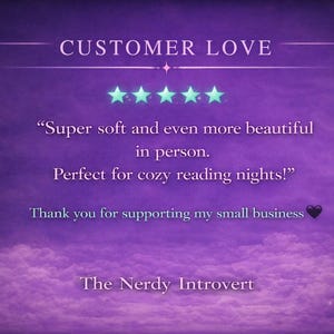 May include: A purple background with the text "CUSTOMER LOVE" and customer feedback. The text includes a quote about softness and beauty, and mentions cozy reading nights. The Nerdy Introvert is also mentioned.