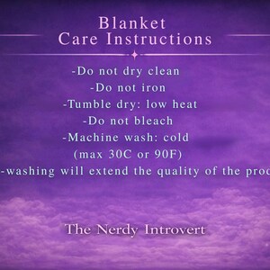 May include: A purple background with white text detailing blanket care instructions. The text includes "Do not dry clean", "Do not iron", "Tumble dry: low heat", "Do not bleach", and "Machine wash: cold (max 30C or 90F)". The Nerdy Introvert is at the bottom.