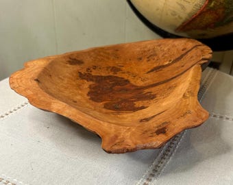 Hand carved cherry live edge wooden bowl with dark hue epoxy inlay.