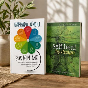 May include: Two books by Barbara O'Neill are displayed on a wooden surface. The book on the left is titled "Sustain Me" and features a colorful floral design. The book on the right is titled "Self heal by design" with a green cover.
