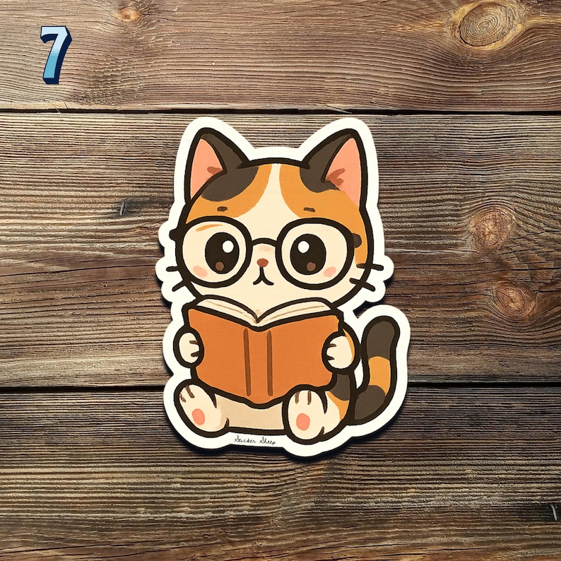 May include: A sticker featuring a cartoon cat wearing glasses and reading a book. The cat has orange, white, and black fur. The sticker is on a wooden surface. The number 7 is in the upper left corner.