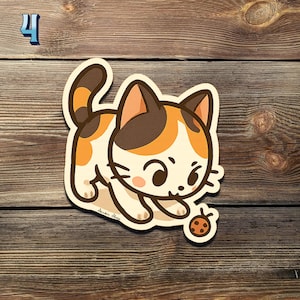 May include: A sticker featuring a cartoon calico cat with brown, orange, and white markings. The cat is playfully reaching for a small ladybug. The number "4" is in the upper left corner.