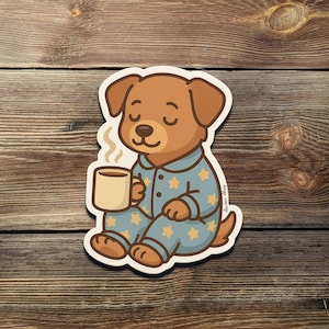 Cute Dog in Pajamas Sticker – Cozy Pup with Coffee Vinyl Decal, Sleepy Dog Aesthetic, Perfect for Laptop, Journal, Water Bottle