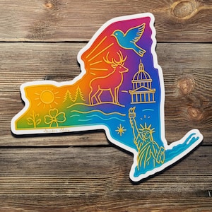 May include: A colorful sticker in the shape of New York State, featuring iconic landmarks and symbols. The design includes a deer, the Statue of Liberty, a dove, and a capitol building, all outlined in yellow against a rainbow gradient.