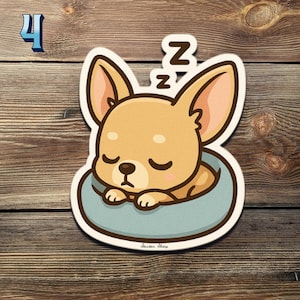 May include: A sticker of a cartoon chihuahua asleep in a light blue bed. The dog is tan with large ears and closed eyes, with two "Z"s above its head. The sticker has a white border and the number "4" in the upper left corner.