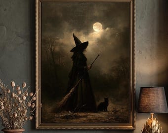 May include: A framed wall art print depicting a silhouette of a figure in a pointed hat holding a broomstick, standing with a black cat under a full moon in a dark, cloudy landscape. The artwork is encased in a simple, thin gold-toned frame.