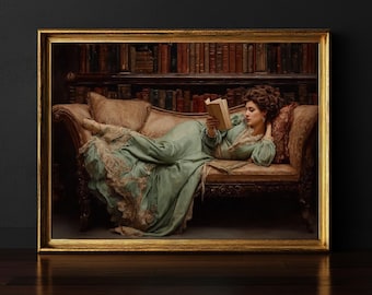 May include: A framed print of a woman in a flowing green dress reading a book while reclining on a chaise lounge. The lounge is brown with decorative carvings. A bookshelf filled with books is in the background. The frame is gold.