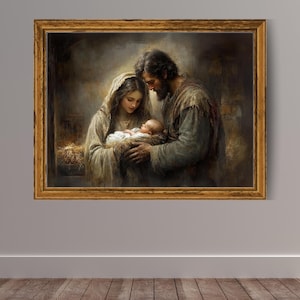 May include: A framed artwork depicting a tender scene of a family. The painting shows a woman and a man gazing at a baby wrapped in white. The artwork is in a gold-colored frame, and the overall color palette is warm and muted.