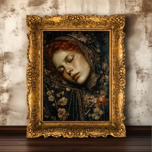 May include: A framed portrait of a woman with red hair, eyes closed, wearing a dark, ornate head covering. The painting is in a gold, ornate frame. The woman's skin is pale, and the background is dark with floral details.