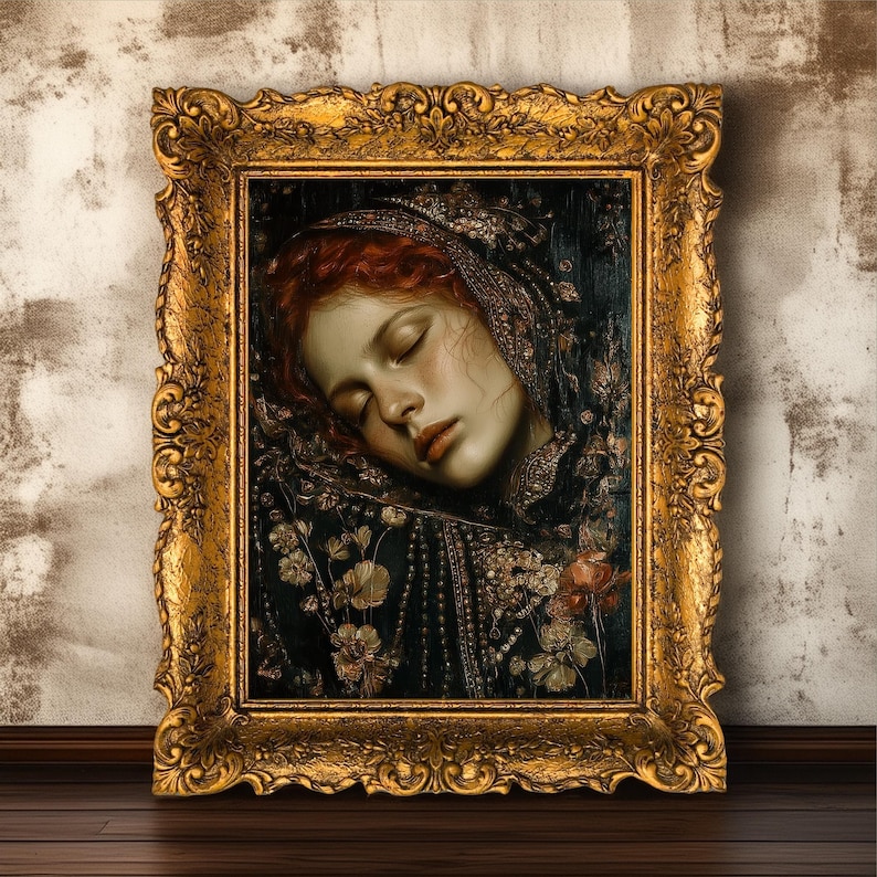 May include: A framed portrait of a woman with red hair, eyes closed, wearing a dark, ornate head covering. The painting is in a gold, ornate frame. The woman's skin is pale, and the background is dark with floral details.