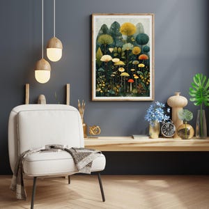 May include: A framed art print depicting a fantastical forest with vibrant trees and mushrooms. The artwork is in a wooden frame, mounted on a dark grey wall. A white chair with a blanket and decorative lamps are in the foreground.