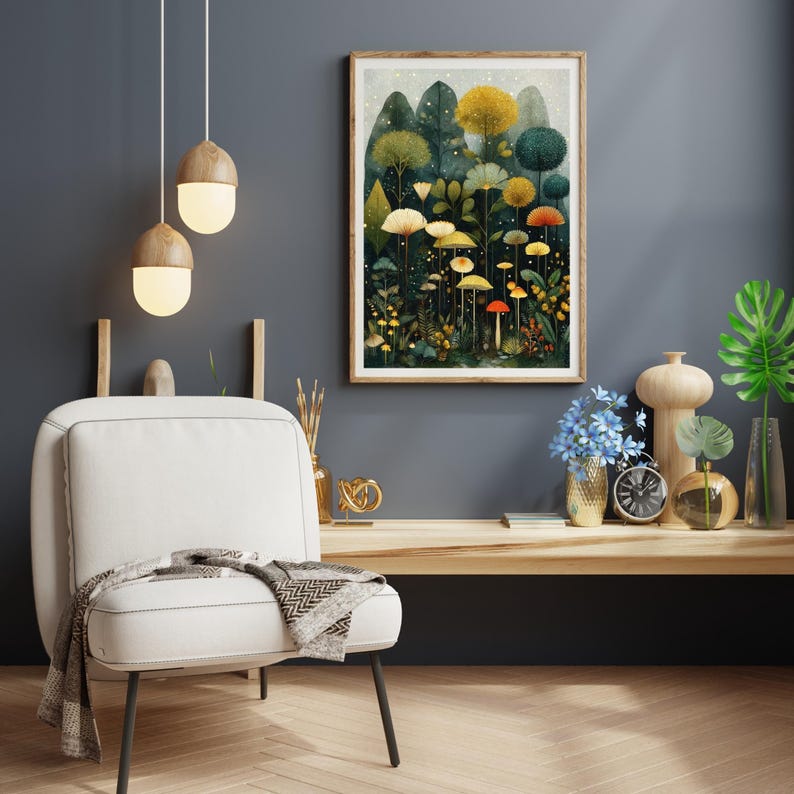 May include: A framed art print depicting a fantastical forest with vibrant trees and mushrooms. The artwork is in a wooden frame, mounted on a dark grey wall. A white chair with a blanket and decorative lamps are in the foreground.