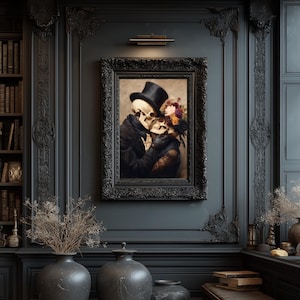 May include: A framed artwork depicts two skeletons embracing, one wearing a top hat and the other adorned with flowers. The painting is set against a dark, ornate wall, with decorative vases and a bookshelf visible in the background. The frame is black.