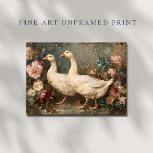 May include: Fine art print featuring two white geese with orange beaks and feet, set against a backdrop of colorful flowers. The artwork has a vintage aesthetic, with the text "FINE ART UNFRAMED PRINT" at the top.