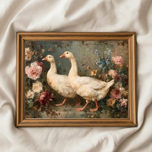 May include: A framed painting featuring two white geese with orange beaks and feet, set against a backdrop of colorful flowers. The artwork is in a wooden frame, with a vintage aesthetic. The flowers include pink, red, and blue blooms.