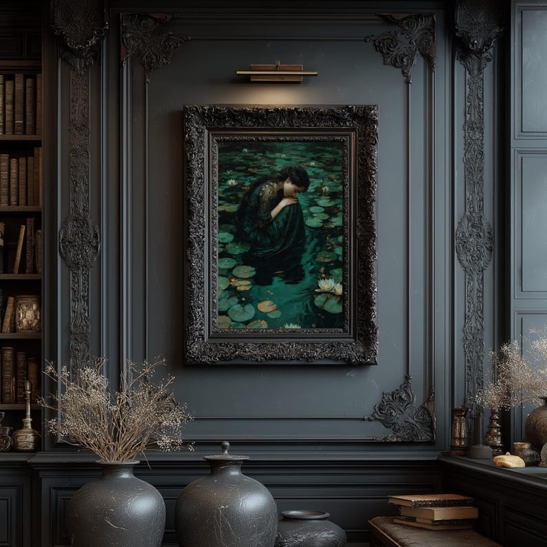 May include: A framed painting depicting a woman in a dark green dress seated among lily pads in a pond. The painting is in a black ornate frame, mounted on a dark gray wall. The room features dark decor, including vases and a bookshelf.