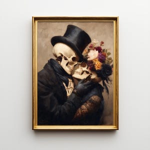 May include: A framed wall art print depicting two skeletons in an embrace. One skeleton wears a black top hat and coat, while the other is adorned with a vibrant bouquet of multi-colored flowers including pink, yellow, and purple blooms.