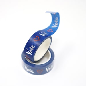 Blue and silver "Vote!" washi tape, perfect for decorating your postcards to voters!