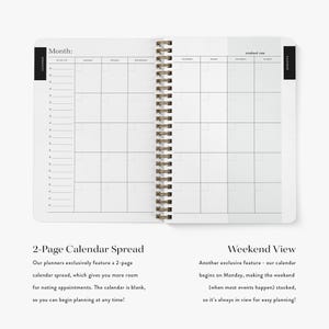 May include: A spiral-bound planner open to a two-page monthly calendar spread. The left page features a vertical to-do list column and days Monday through Wednesday. The right page displays Thursday through Sunday with a weekend view section.