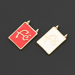 May include: Two rectangular pendants with gold borders. One is red with the word "fé" in gold script, the other white with the same script. Both have small loops at the top for attaching to a chain.