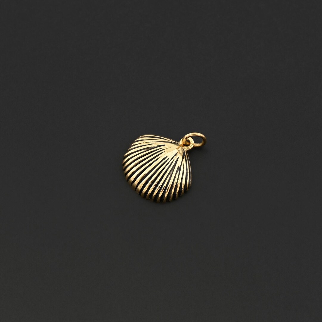 Elegant Gold Shell Charm Symbolizing Beach Beauty Perfect for Coastal ...