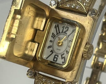 Anne Klein Swiss Timepiece Faux Diamond Gold Tone "peek-a-boo" or hidden face watch" new battery