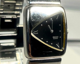 Seiko Quartz Rivoli Half Moon Asymmetrical Silver Case Black Dial Integrated Bracelet Vintage Japanese Dress Watch Circa 1986, New Battery