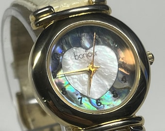 vintage Bonjour women's quartz, unique mother-of-pearl heart design on the dial. Gold-tone, genuine beige/cream leather strap new battery