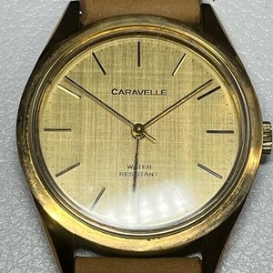 Rare Vintage mechanical wind up Caravelle by Bulova wristwatch gold-toned dial with simple hour markers and hands with new battery ticking